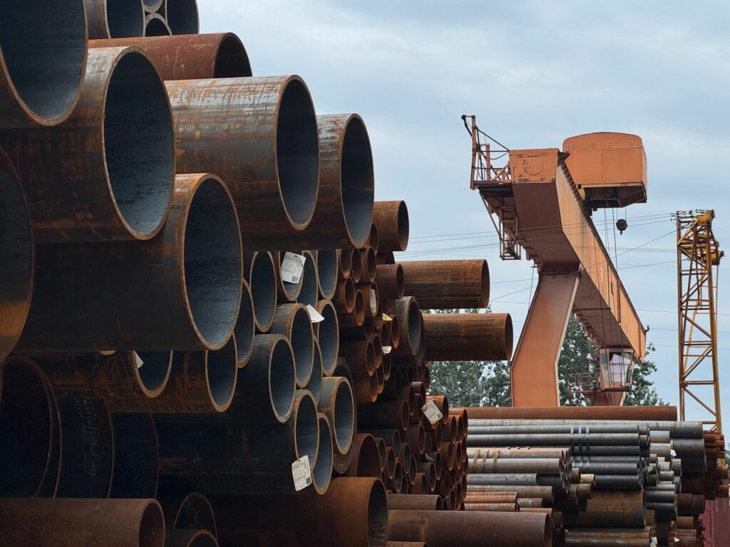 Preventing Rust and Corrosion in Industrial Steel Tubing stacked steel pipes in an outdoor yard