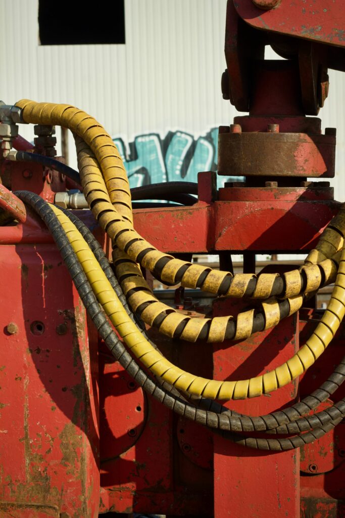 Industrial Hose Selection Malaysia: The Guide to Zero Downtime spiral-guarded hoses on industrial machinery